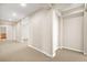Long hallway with carpet and neutral walls at 7258 Sashaying Spirit Ct, Las Vegas, NV 89131