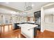 Island kitchen with dark cabinetry, granite counters and stainless steel appliances at 7258 Sashaying Spirit Ct, Las Vegas, NV 89131