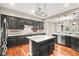 Spacious kitchen with island, dark cabinets, granite counters at 7258 Sashaying Spirit Ct, Las Vegas, NV 89131