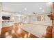 Spacious living area with hardwood floors, large windows, and high ceilings at 7258 Sashaying Spirit Ct, Las Vegas, NV 89131