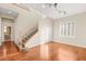 Spacious living room with hardwood floors and a view of the staircase at 7258 Sashaying Spirit Ct, Las Vegas, NV 89131