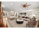 Virtually staged living room with comfortable seating and stylish decor at 7258 Sashaying Spirit Ct, Las Vegas, NV 89131