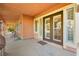 Covered patio with double doors and access to backyard at 7258 Sashaying Spirit Ct, Las Vegas, NV 89131