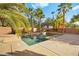 Inviting pool with spa and surrounding landscaping at 7258 Sashaying Spirit Ct, Las Vegas, NV 89131