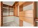 Large walk-in closet with custom built-in shelving and drawers at 7258 Sashaying Spirit Ct, Las Vegas, NV 89131