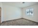 Spacious bedroom with neutral walls and carpet flooring at 7322 N Decatur Blvd # 1, Las Vegas, NV 89131