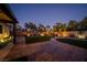 Well-lit backyard oasis with artificial turf and patio at 7620 Chase Hallow St, Las Vegas, NV 89149