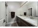 Modern bathroom with double vanity and granite countertops at 7620 Chase Hallow St, Las Vegas, NV 89149