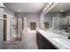 Elegant bathroom with double vanity, soaking tub, and separate shower at 7620 Chase Hallow St, Las Vegas, NV 89149