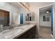 Bathroom with double vanity and granite countertops at 7620 Chase Hallow St, Las Vegas, NV 89149