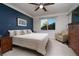 Spacious Primary bedroom with a large bed and sitting area at 7620 Chase Hallow St, Las Vegas, NV 89149