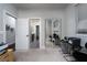 Bedroom with mirrored closet doors and access to bathroom at 7620 Chase Hallow St, Las Vegas, NV 89149