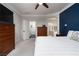 Primary bedroom with large bed, dresser, and ensuite access at 7620 Chase Hallow St, Las Vegas, NV 89149