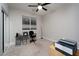 Bright bedroom with carpeted floors and a desk area at 7620 Chase Hallow St, Las Vegas, NV 89149