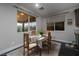 Bright dining area with a four-person table and chairs at 7620 Chase Hallow St, Las Vegas, NV 89149