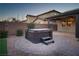 Relaxing hot tub on a brick patio in the backyard at 7620 Chase Hallow St, Las Vegas, NV 89149