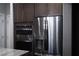 Sleek kitchen featuring stainless steel appliances and granite countertops at 7620 Chase Hallow St, Las Vegas, NV 89149
