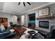 Spacious living room with a fireplace, hardwood floors, and ample seating at 7620 Chase Hallow St, Las Vegas, NV 89149
