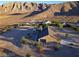 Aerial view of a house on a large lot with mountain views at 8068 Buena Vida St, Las Vegas, NV 89166