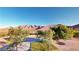 Landscaped backyard with mountain views and a picnic table at 8068 Buena Vida St, Las Vegas, NV 89166