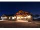 Night view of a single-story home with a covered porch and well-lit entryway at 8068 Buena Vida St, Las Vegas, NV 89166