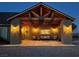 Night view of a home's front porch with a wood pergola and lighting at 8068 Buena Vida St, Las Vegas, NV 89166