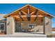 Inviting front porch with wood beams and covered seating at 8068 Buena Vida St, Las Vegas, NV 89166