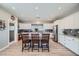 Spacious kitchen featuring white cabinets, stainless steel appliances, and an island at 8068 Buena Vida St, Las Vegas, NV 89166