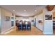 Modern kitchen with white cabinets and an island with seating at 8068 Buena Vida St, Las Vegas, NV 89166