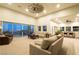 Living room with large windows, high ceilings, and patio access at 8068 Buena Vida St, Las Vegas, NV 89166