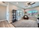 Bright living room with a comfy armchair and large windows at 8068 Buena Vida St, Las Vegas, NV 89166