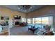 Open living room with stone fireplace and sliding glass doors at 8068 Buena Vida St, Las Vegas, NV 89166