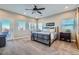 Comfortable main bedroom with a ceiling fan and access to a private door at 8068 Buena Vida St, Las Vegas, NV 89166