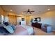 Spacious main bedroom with a large TV and sliding barn door at 8068 Buena Vida St, Las Vegas, NV 89166