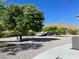 Spacious RV pad with gravel surface, mature trees, and a mountain view at 8068 Buena Vida St, Las Vegas, NV 89166