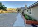 Landscaped side yard with pathway and raised garden beds at 8068 Buena Vida St, Las Vegas, NV 89166