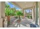 Covered patio with lush landscaping and plants at 8212 Opal Falls St, North Las Vegas, NV 89085