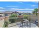 Private balcony with small table and chairs, offering neighborhood views at 8212 Opal Falls St, North Las Vegas, NV 89085