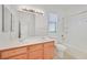 Clean bathroom with double vanity and bathtub at 8212 Opal Falls St, North Las Vegas, NV 89085