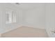 Simple bedroom with neutral walls and carpet flooring at 8212 Opal Falls St, North Las Vegas, NV 89085