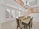 Bright dining room with a large table and access to the backyard at 8212 Opal Falls St, North Las Vegas, NV 89085