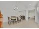 Formal dining room with a chandelier and six chairs at 8212 Opal Falls St, North Las Vegas, NV 89085