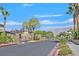 Gated community entrance with landscaping and mountains in background at 8212 Opal Falls St, North Las Vegas, NV 89085