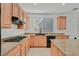 Kitchen with gas range, light wood cabinets, and granite countertops at 8212 Opal Falls St, North Las Vegas, NV 89085