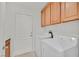 Laundry room with washer, dryer, and cabinets at 8212 Opal Falls St, North Las Vegas, NV 89085