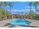 Community pool with lounge chairs and palm trees at 8212 Opal Falls St, North Las Vegas, NV 89085