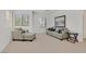 Relaxing sitting area with a sofa, chair, and ottoman at 8212 Opal Falls St, North Las Vegas, NV 89085