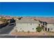 Aerial view of a townhome community, showcasing multiple two-story units with attached garages at 8486 Insignia Ave # 101, Las Vegas, NV 89178