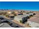 Aerial perspective of a townhome community, showcasing multiple units and surrounding landscape at 8486 Insignia Ave # 101, Las Vegas, NV 89178