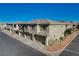 Aerial view of a two-story townhome with attached garage and a quiet neighborhood at 8486 Insignia Ave # 101, Las Vegas, NV 89178